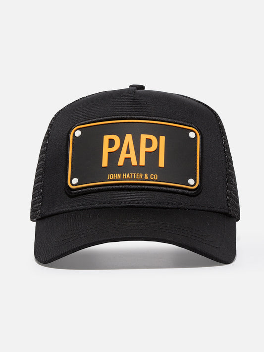 Black PAPI trucker cap, front view of the embossed rubber statement plate